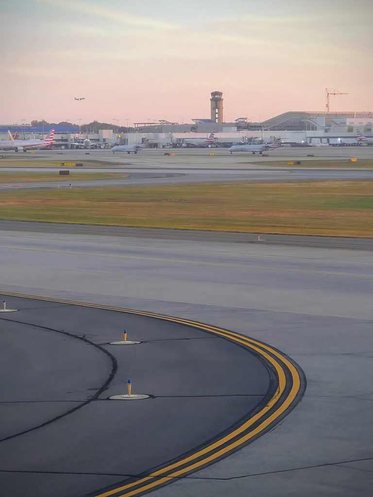 sunset busy airport with taxiway aircraft ground